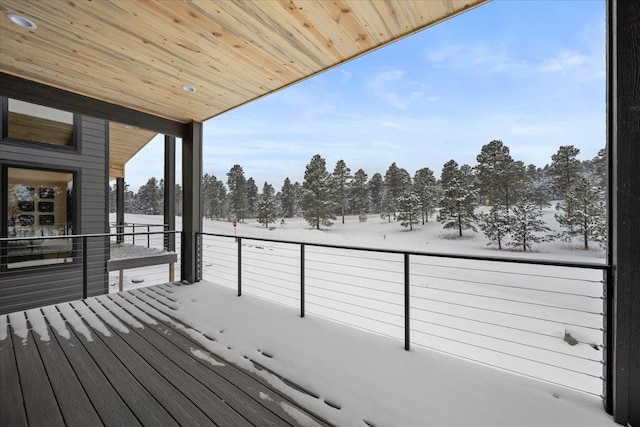 view of snow covered deck