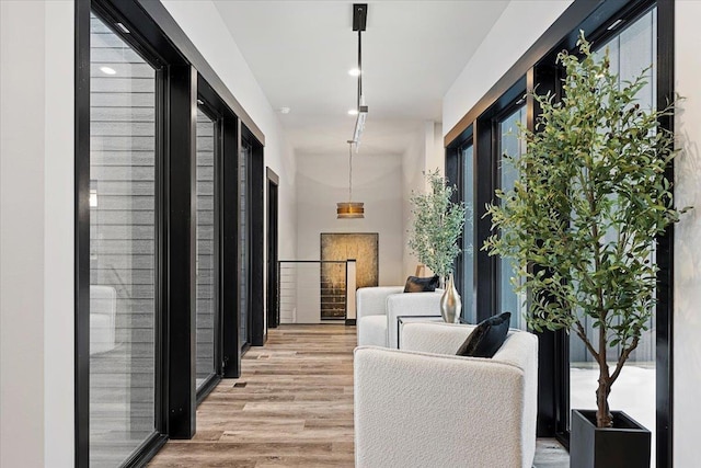 hallway featuring light wood-style flooring