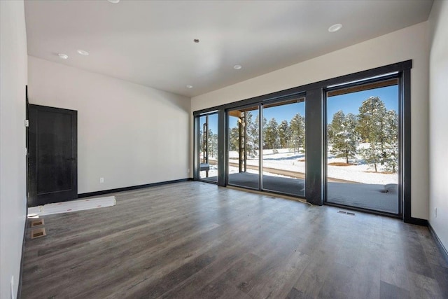 unfurnished room featuring dark hardwood / wood-style floors