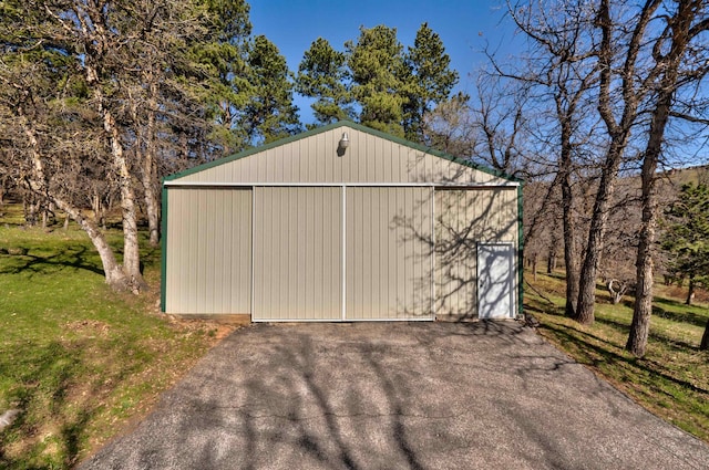 garage featuring a yard