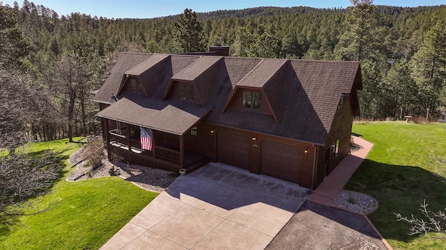 view of front of house with a garage and a front yard