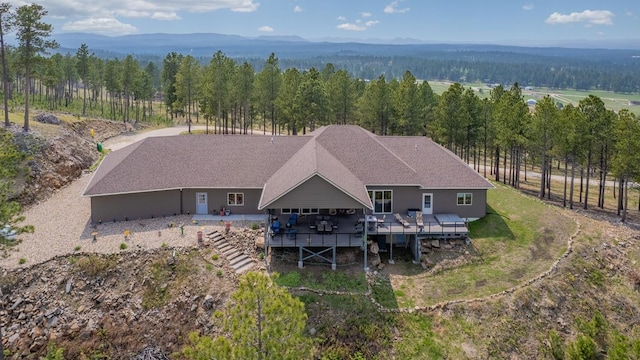 birds eye view of property featuring a mountain view