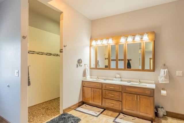 bathroom with vanity with extensive cabinet space, dual sinks, and tile floors