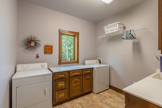 laundry room featuring washing machine and dryer, washer hookup, and light tile floors