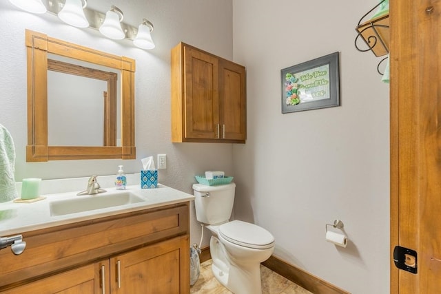 bathroom with tile flooring, oversized vanity, and toilet