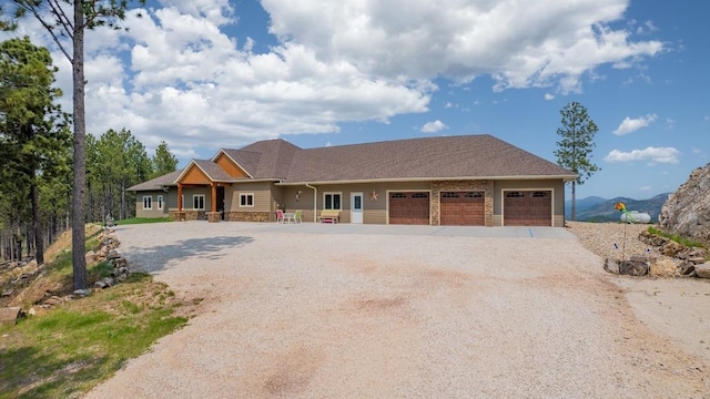 view of front of property featuring a garage and a porch