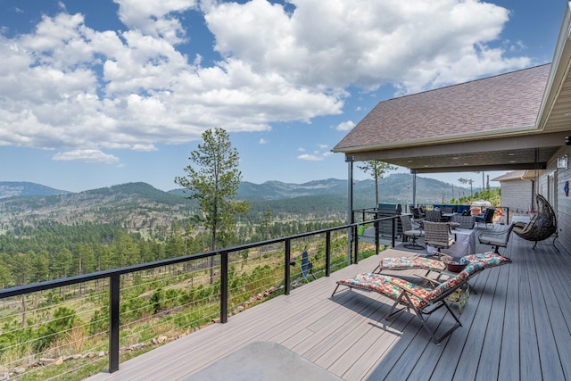 wooden deck featuring a mountain view