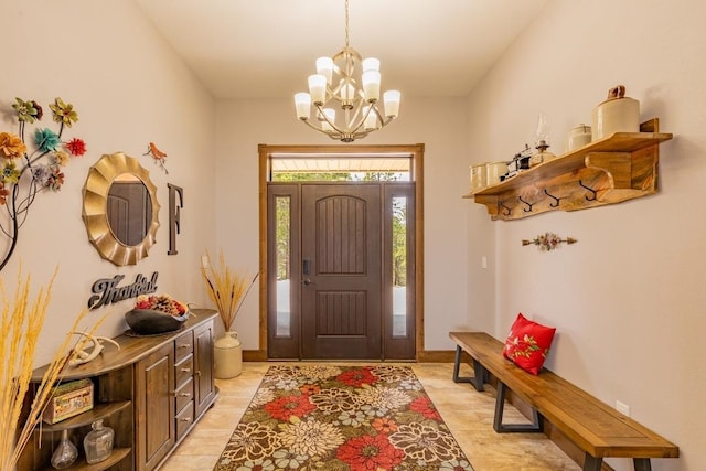 foyer with an inviting chandelier