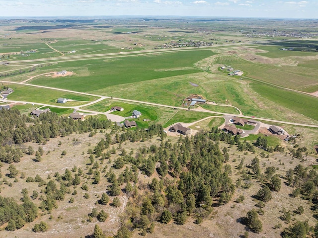 birds eye view of property with a rural view