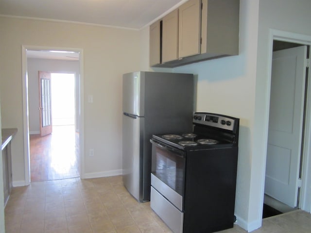 kitchen with stainless steel electric stove and light tile flooring