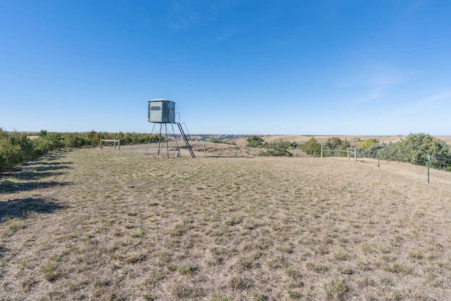 view of yard with a rural view