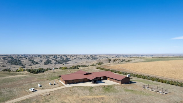 birds eye view of property featuring a rural view