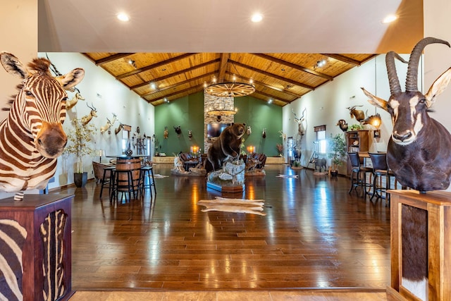 living room with beam ceiling, wooden ceiling, and hardwood / wood-style flooring