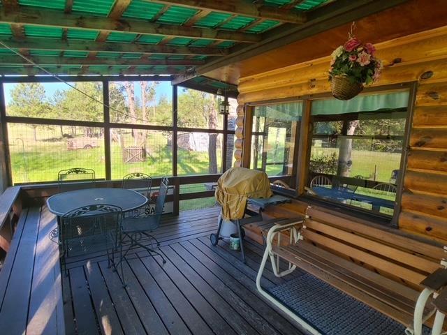 sunroom with beamed ceiling