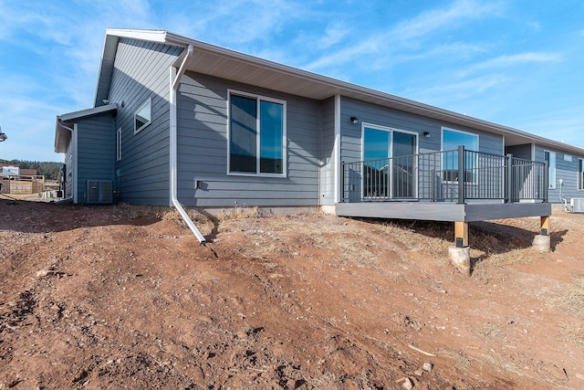 back of property featuring central air condition unit