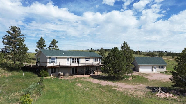 rear view of property featuring a wooden deck