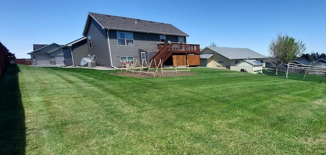1013 Gladys St, Rapid City, SD 57701 - rear view of house with a wooden deck and a yard