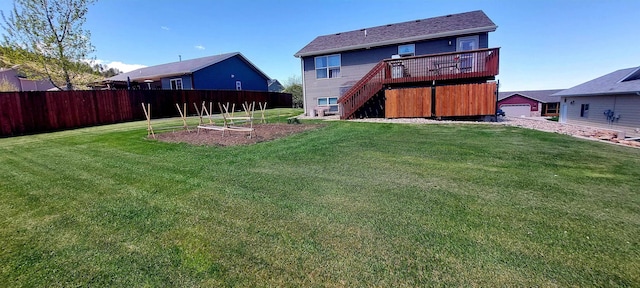 1013 Gladys St, Rapid City, SD 57701 - rear view of property featuring a deck and a yard