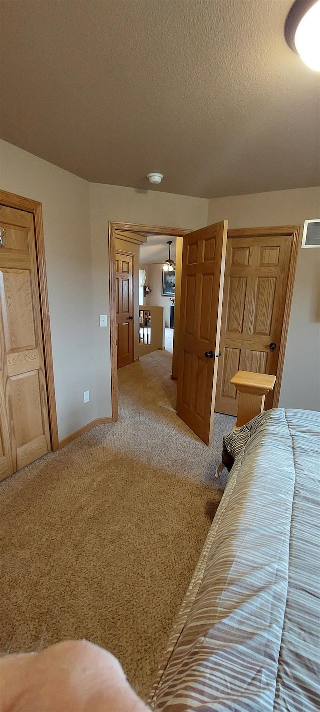 1013 Gladys St, Rapid City, SD 57701 - carpeted bedroom featuring a textured ceiling