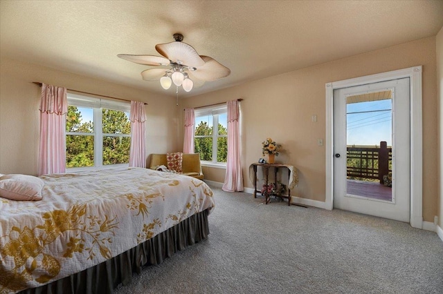 bedroom featuring carpet, a textured ceiling, access to outside, and ceiling fan