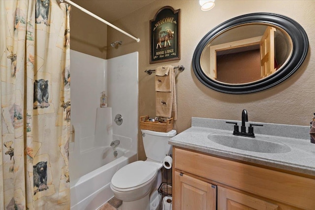 full bathroom featuring shower / tub combo, vanity, and toilet