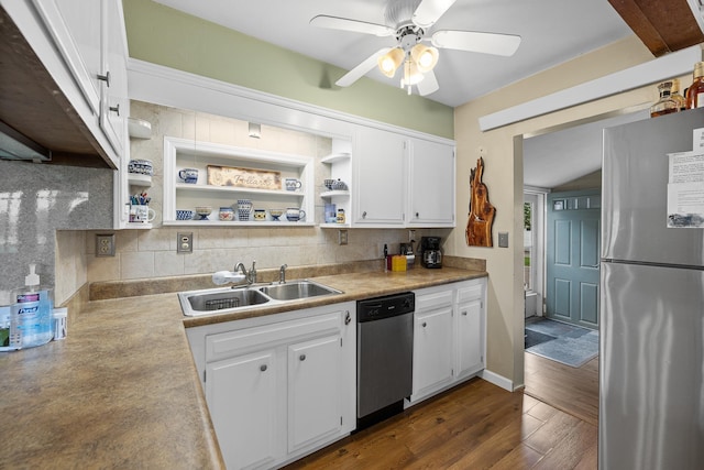 kitchen with white cabinetry, stainless steel appliances, dark hardwood / wood-style floors, backsplash, and ceiling fan