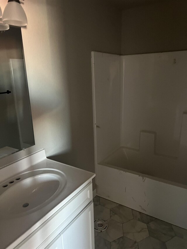 bathroom with vanity and tub / shower combination