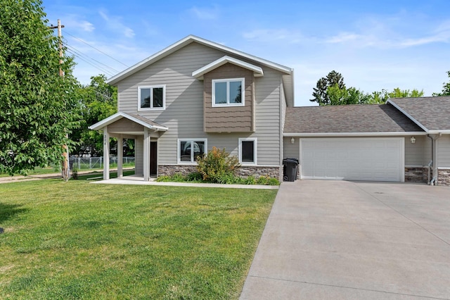 view of front of property featuring a front yard and a garage