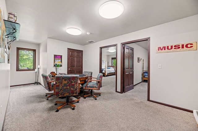 view of carpeted dining space