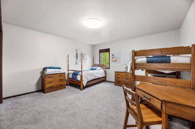 bedroom featuring light colored carpet