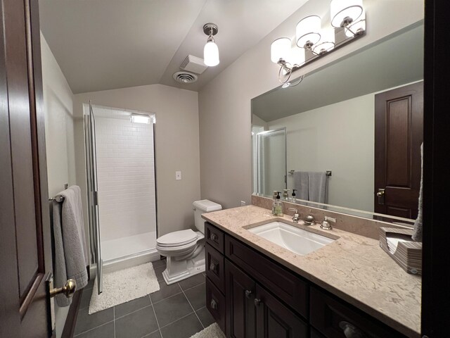 bathroom featuring tile flooring, an enclosed shower, vaulted ceiling, oversized vanity, and toilet