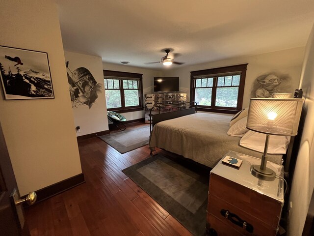 bedroom featuring dark hardwood / wood-style floors and ceiling fan