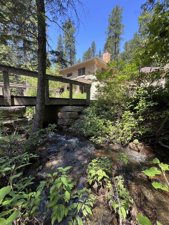 exterior space with a deck with water view