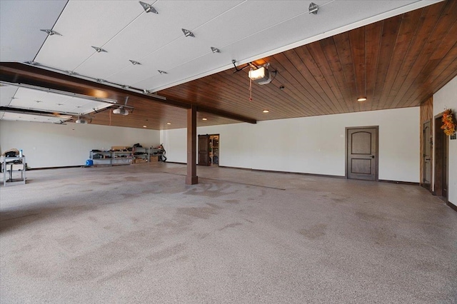 garage featuring a garage door opener and wood ceiling