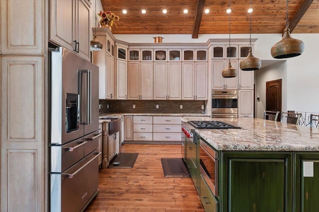 kitchen featuring a kitchen island, beamed ceiling, appliances with stainless steel finishes, wooden ceiling, and decorative backsplash