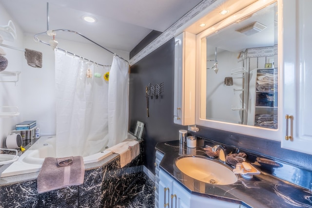 11504 Melchert Pl, Hill City, SD 57745 - full bathroom featuring visible vents, shower / bath combo with shower curtain, and vanity