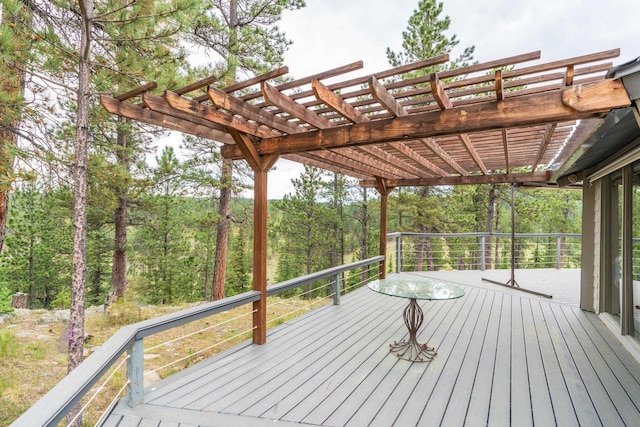 11504 Melchert Pl, Hill City, SD 57745 - wooden terrace featuring a view of trees and a pergola