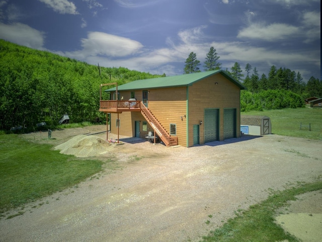 view of outdoor structure featuring a lawn and a garage