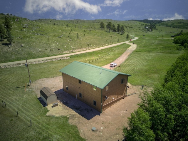 birds eye view of property featuring a rural view