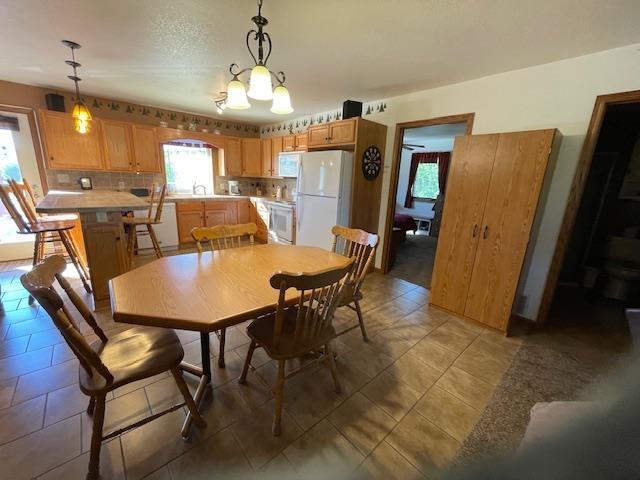 dining room featuring a notable chandelier