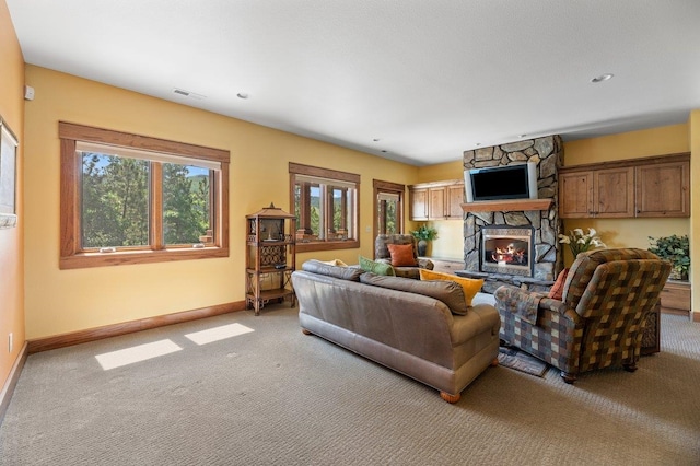 living room with carpet flooring and a fireplace