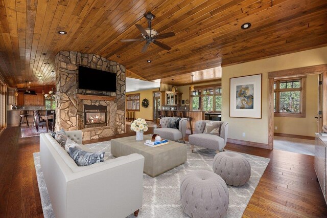 living room with a stone fireplace, lofted ceiling, wooden ceiling, ceiling fan, and wood-type flooring