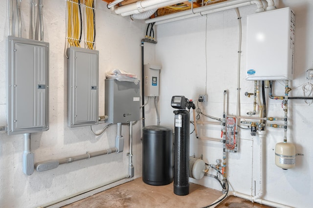 utility room featuring electric panel and water heater