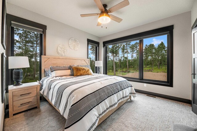 21242 Rubys Way, Lead, SD 57754 - bedroom featuring baseboards, a ceiling fan, and visible vents