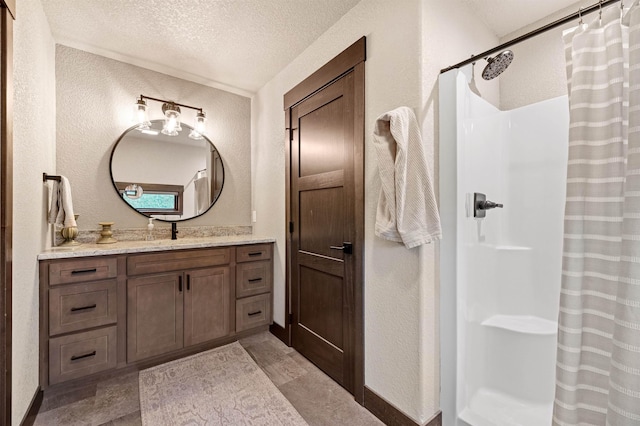 21242 Rubys Way, Lead, SD 57754 - bathroom with a textured wall, vanity, a textured ceiling, and curtained shower