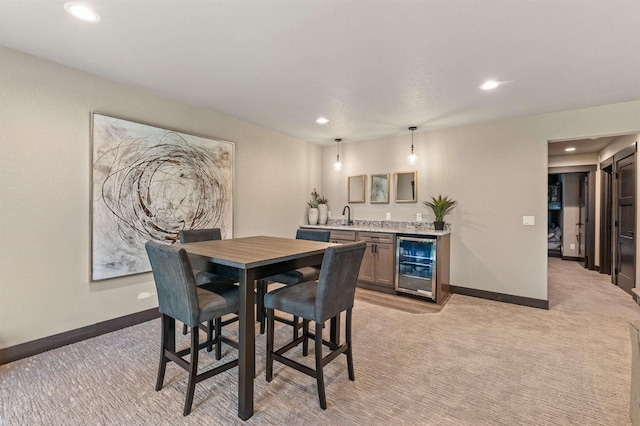 21242 Rubys Way, Lead, SD 57754 - dining room with light carpet, wet bar, beverage cooler, and recessed lighting