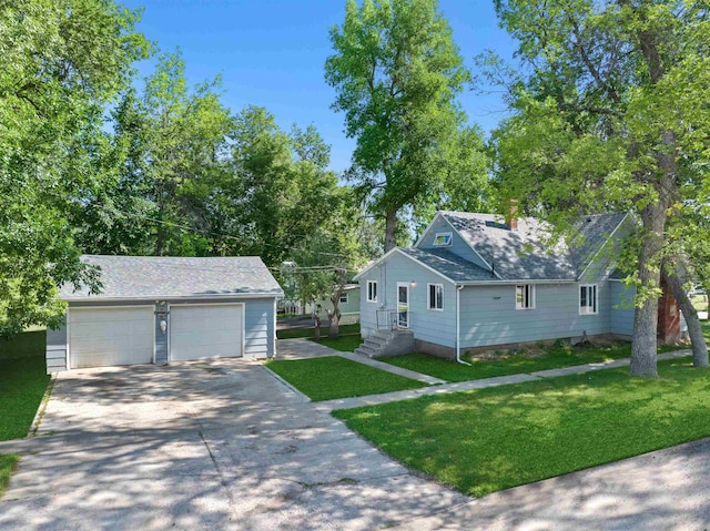 view of front of property featuring a garage and a front yard