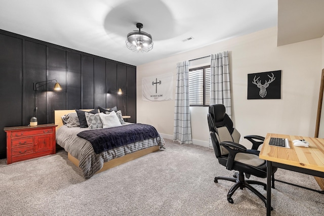 bedroom featuring carpet flooring and baseboards