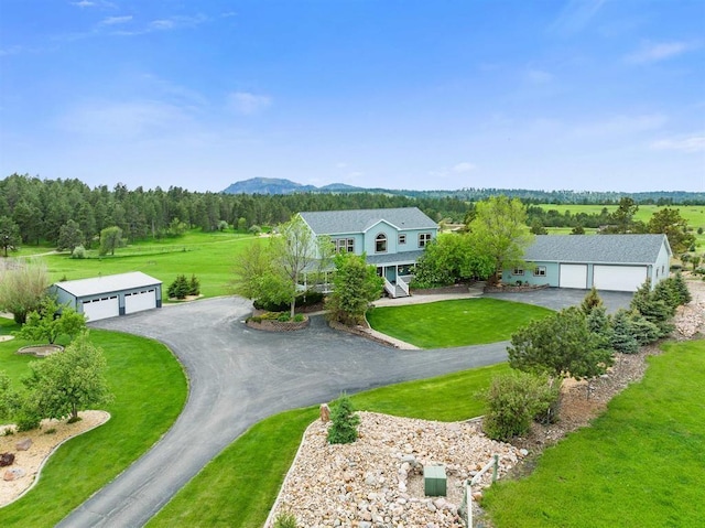 exterior space featuring a lawn and a garage