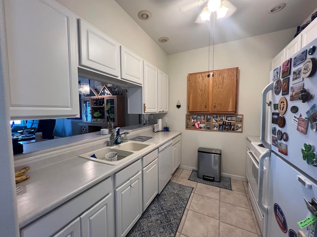 kitchen featuring white cabinetry, light tile patterned flooring, ceiling fan, white appliances, and sink